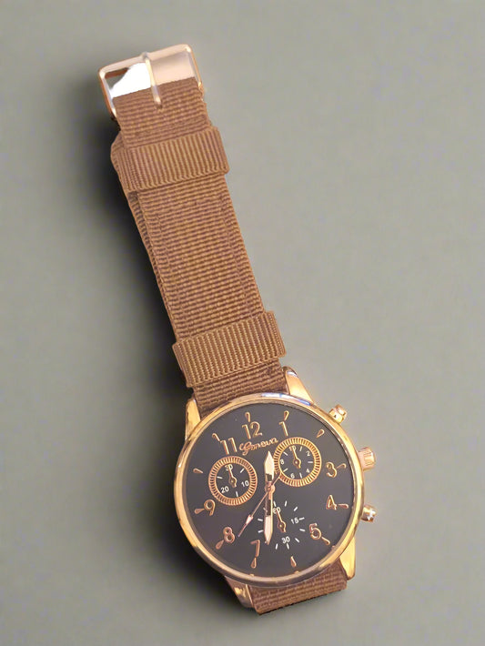 BRAND NEW GENEVA QUARTZ WRIST WATCH, WITH BROWN CANVAS STRAP. LARGE FACE